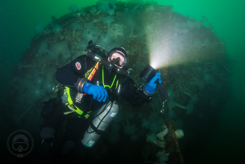 Bill Golley under the stern of the Rivtow Lion